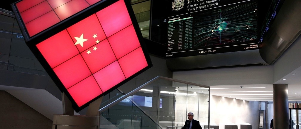 An illuminated cube bearing the Chinese flag is seen in the entrance foyer of the London Stock Exchange in London